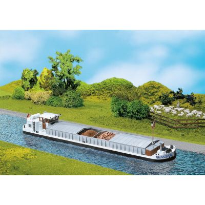 River cargo boat with dwelling cabin